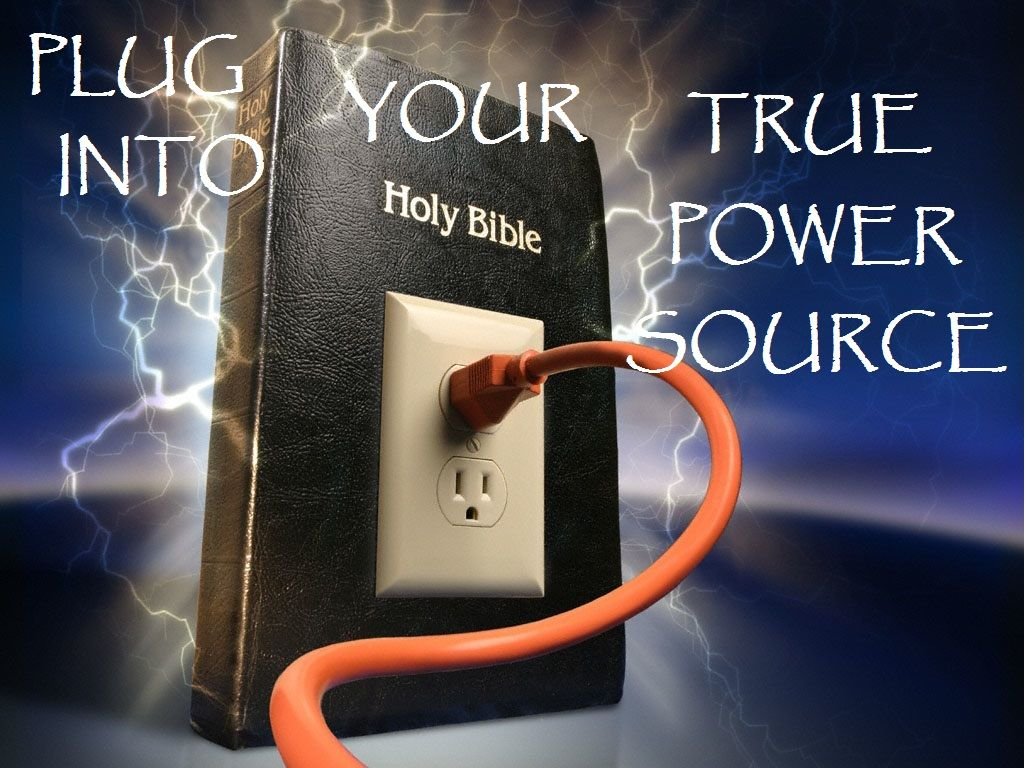 a power cord plugged into Holy Bible book